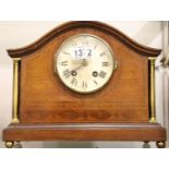 Edwardian inlaid mantel clock with brass pillars and pendulum. Not available for in-house P&P,