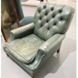 Large green leather low seated buttoned back Chesterfield armchair. Not available for in-house P&