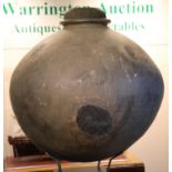 A large 18th century Chinese stoneware egg fermenting chamber, raised on museum plinth with later