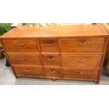 Contemporary medium wood chest of nine drawers, 153 x 46 x 86 cm. Not available for in-house P&P,