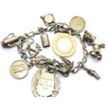 Silver charm bracelet with 14 charms, 48g. P&P Group 1 (£14+VAT for the first lot and £1+VAT for