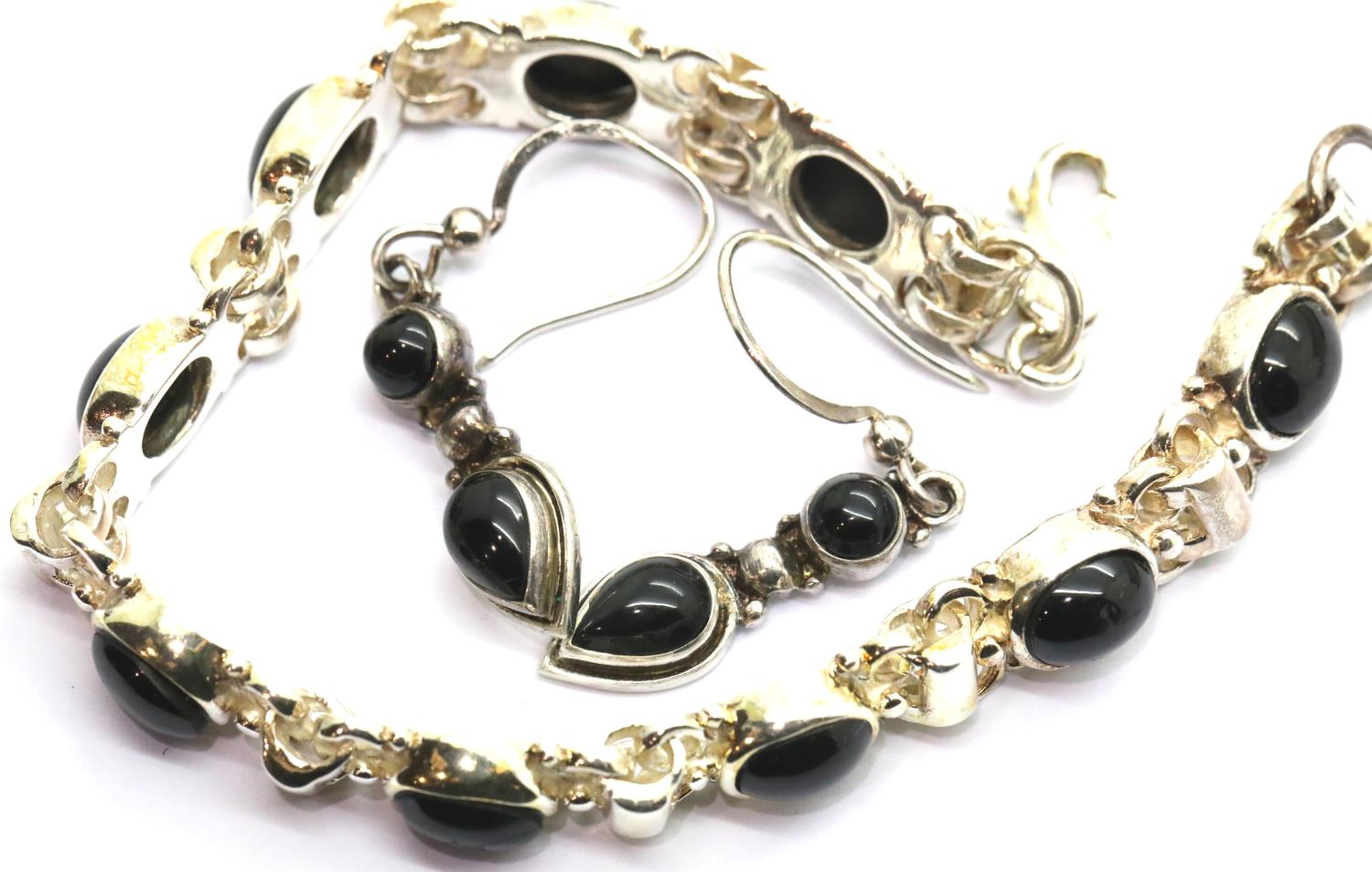 Boxed Whitby jet and silver bracelet and earringsset. P&P Group 1 (£14+VAT for the first lot and £