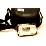 Cased Sony DCR-SR32 handycam lacking charger. P&P Group 2 (£18+VAT for the first lot and £3+VAT