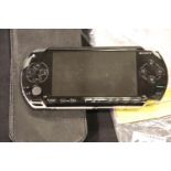 Sony PSP handheld computer game with leather case and accessories. P&P Group 3 (£25+VAT for the
