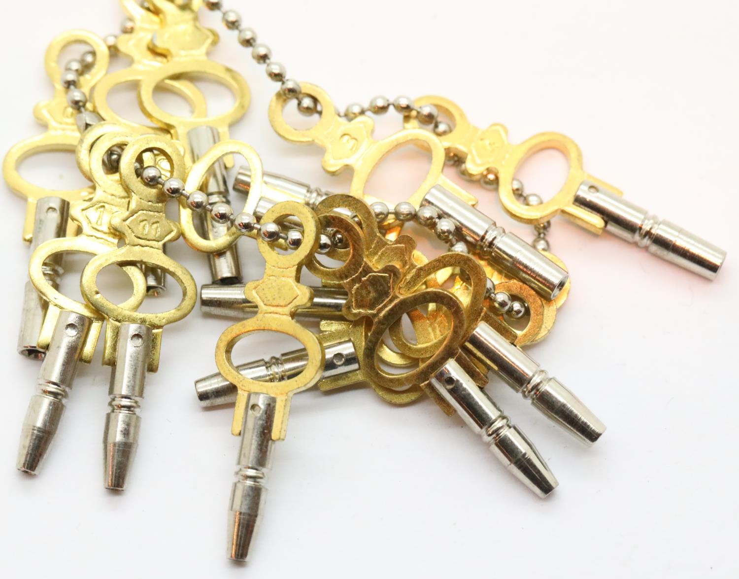 New old stock collection of 14 different sized pocket watch keys. P&P Group 1 (£14+VAT for the first