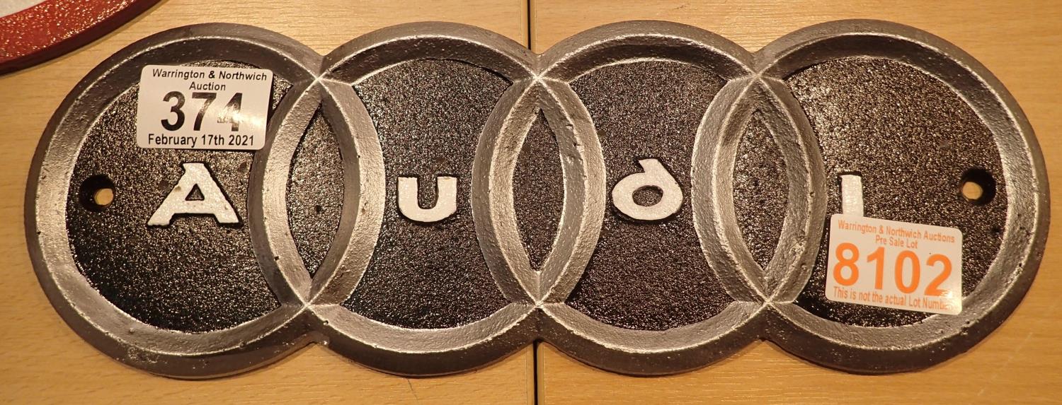 Cast iron Audi sign, 30 x 11 cm. P&P Group 1 (£14+VAT for the first lot and £1+VAT for subsequent