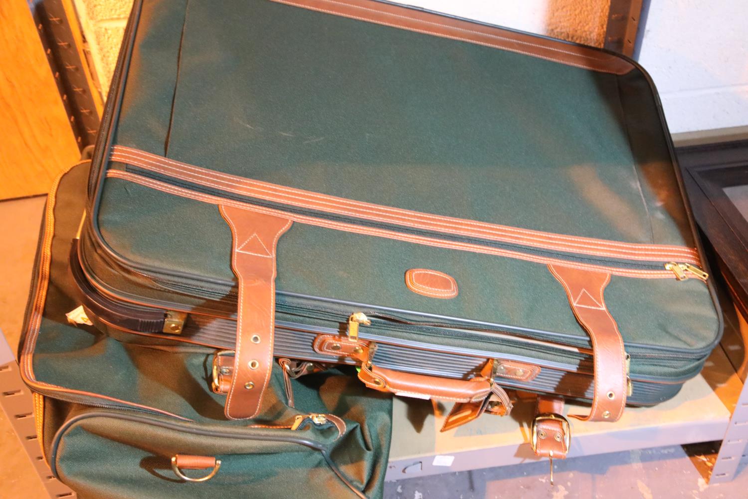 Two large travel suitcases. Not available for in-house P&P, contact Paul O'Hea at Mailboxes on 01925