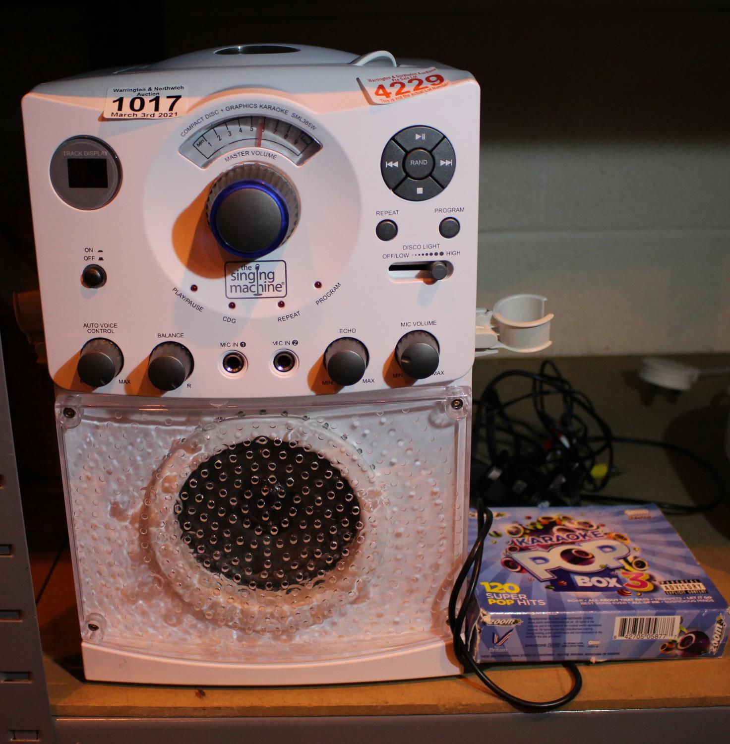 Singing Machine karaoke machine and 6 discs. Not available for in-house P&P, contact Paul O'Hea at