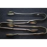 Three mixed sugar tongs including Virginia Silver. P&P Group 1 (£14+VAT for the first lot and £1+VAT