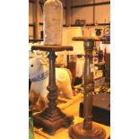 Two wooden turned stands, tallest H: 72 cm and large whisky bottle. Not available for in-house P&