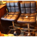 Pair of black leatherette and chrome height adjustable bar stools. Not available for in-house P&P,