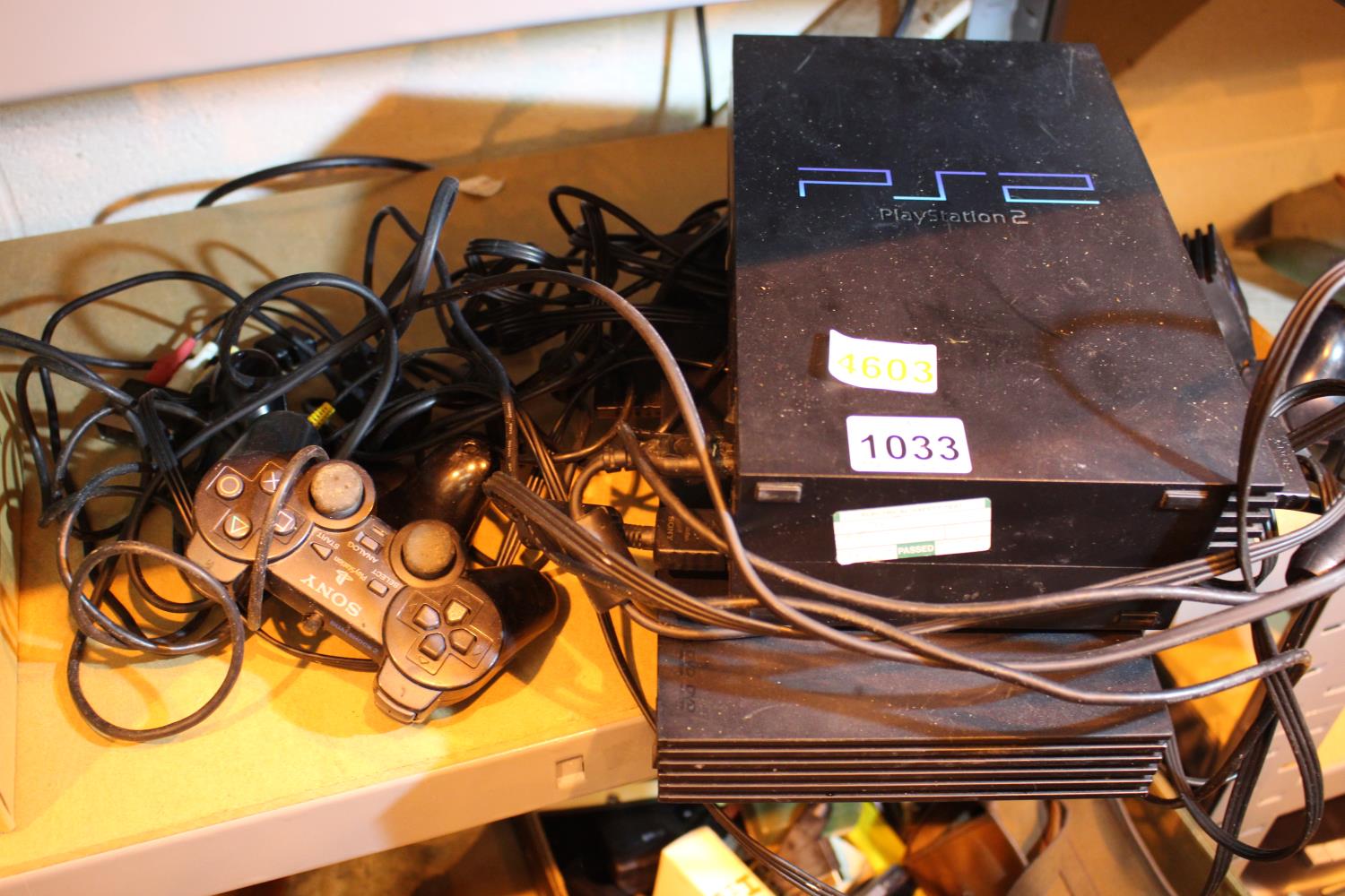 Two PlayStation 2 consoles and three controllers and accessories. Not available for in-house P&P,