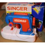 Boxed child's Singer Chainstitch sewing machine. P&P Group 2 (£18+VAT for the first lot and £3+VAT