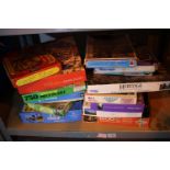 Shelf of mixed jigsaws, contents unchecked. Not available for in-house P&P, contact Paul O'Hea at