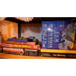 Shelf of mixed games and model kits including Airfix Moonraker (contents unchecked). Not available