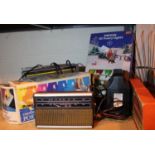 Selection of electrical items including radios, Christmas lights, battery charger. Not available for