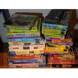Twenty five assorted jigsaws including trains, cars, ships (contents unchecked). Not available for