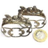 Pair of presumed silver figural napkin rings, no visible marks. Combined 30g. P&P Group 1 (£14+VAT