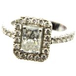 18ct white gold diamond set engagement ring, the central emerald-cut diamond of approximately 1.4cts