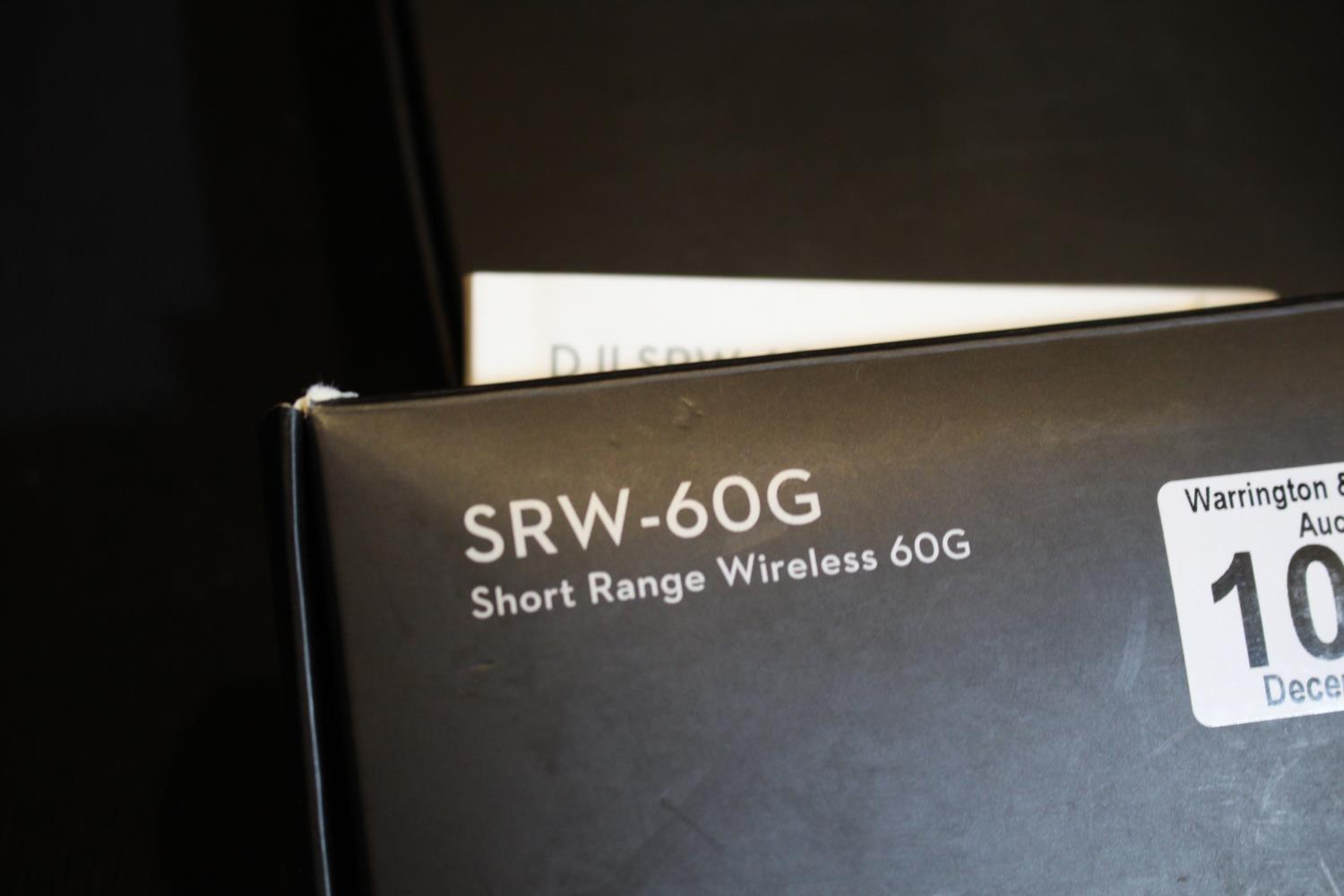 Two dji SRW-60G Short Range Wireless HD video links, one unopened, the second without its mount. P&P - Image 2 of 2