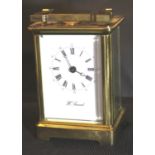 H Samuel brass carriage clock, with key, H: 11 cm. P&P Group 2 (£18+VAT for the first lot and £3+VAT