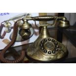 The Duchess telephone with a solid, brass finish and traditional cloth handset and curly cord.