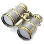 Pair of vintage leather and brass bound binoculars, L: 10 cm. P&P Group 1 (£14+VAT for the first lot
