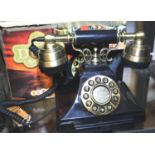 The Duke push button telephone with a black & brass finish and traditional cloth handset curly cord.