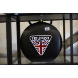 Black Triumph petrol can, H: 38 cm. P&P Group 3 (£25+VAT for the first lot and £5+VAT for subsequent