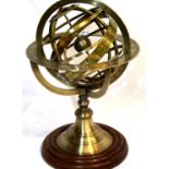 Brass armillary on wooden base, H: 28 cm. P&P Group 2 (£18+VAT for the first lot and £3+VAT for