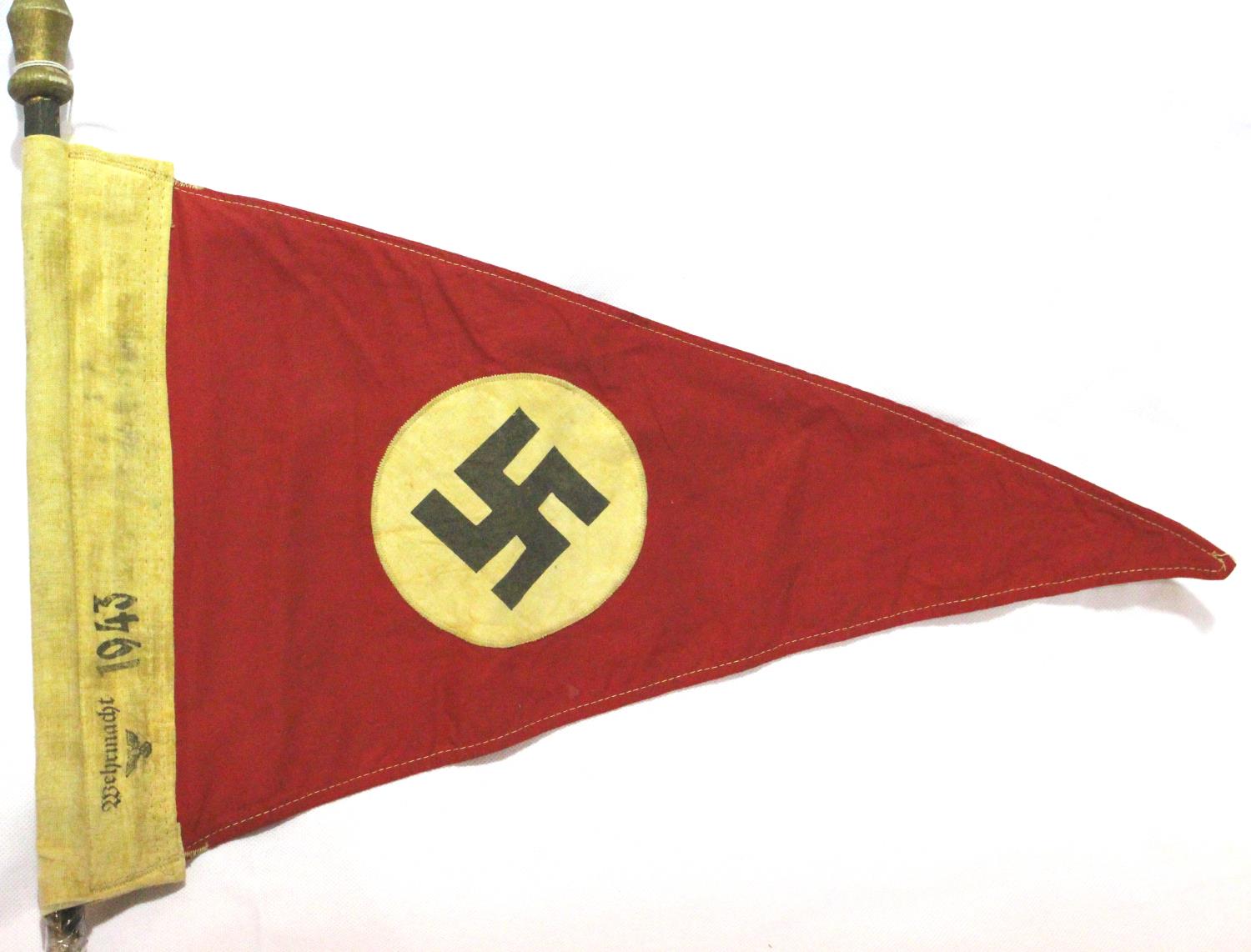 German WWII printed and embroidered pennant with partial pole, stamped Wehrmacht and dated 1943,