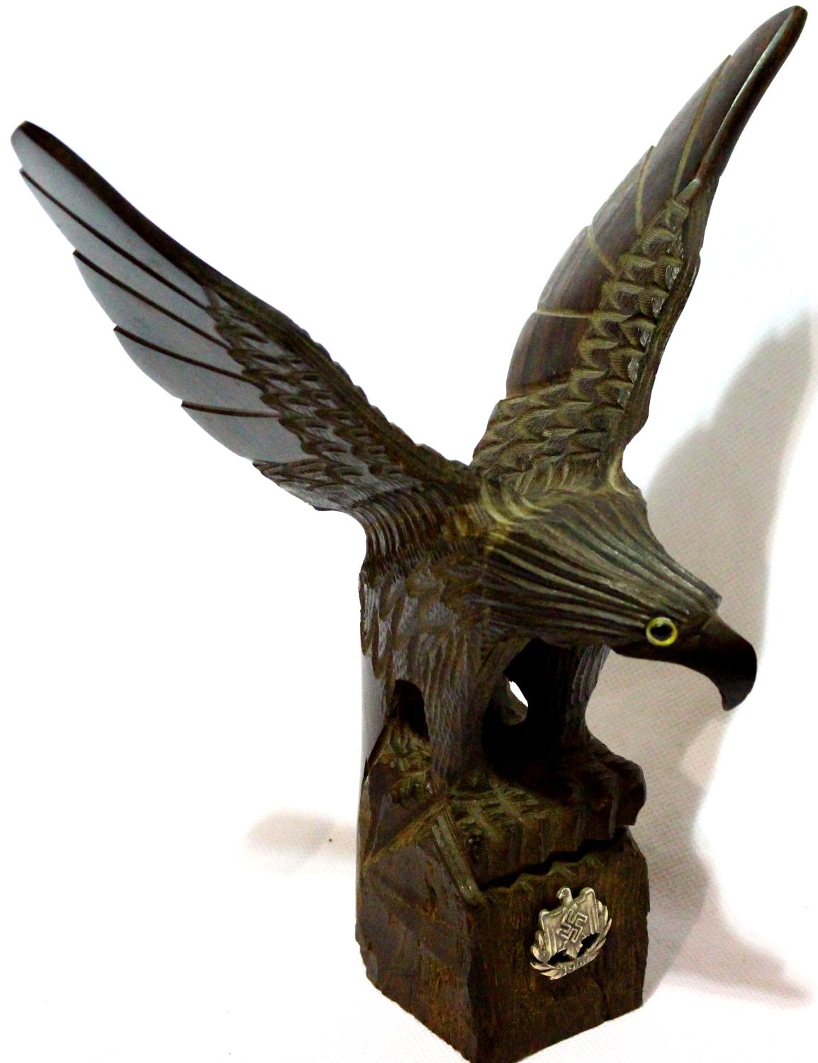 Bavarian carved eagle desk ornament, surmounted with a Wehrmacht 1940 badge, H: 22 cm. P&P Group