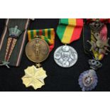 Six mixed world medals, including a Belgian Croix de Guerre. P&P Group 1 (£14+VAT for the first