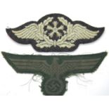 German WWII embroidered breast eagle, believed period, and a later Reichsbahn embroidered cap badge.