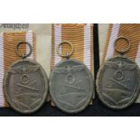 Three unissued German WWII West Wall medals in packets of issue. P&P Group 1 (£14+VAT for the