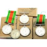 Five British WWII boxed Defence medals, names comprise GAVIN (x2), EDMONDSON, BAKER and NEISON. P&