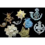 Nine mixed British military cap badges in varying condition. P&P Group 1 (£14+VAT for the first