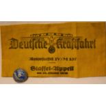 German WWII re-enactment printed Deutsche Kraftfahrt 1936 dated armband, with an enamelled NSKK