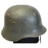 German WWII aged replica steel helmet with liner. P&P Group 2 (£18+VAT for the first lot and £3+