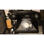 GPO 200 rotary telephone with a metal base and handset; traditional curly, cloth handset cord; is