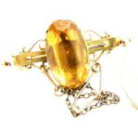 Presumed (unmarked) 15ct gold brooch set with a large citrine with steel pin, 5.4g. P&P Group 1 (£