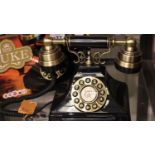 The Duke push button telephone with a black & brass finish and traditional cloth handset curly cord.