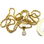 15ct rope necklace with a presumed (unmarked) 18ct pendant set with a single diamond, 5.7g, L: 43