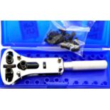 Boxed stainless steel screw back watch opener with adjustable pins. P&P Group 1 (£14+VAT for the