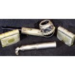 Two silver plated book form vesta cases, a cylindrical petrol lighter and a white metal bound