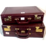 Two oxblood leather briefcases both with combination locks. P&P Group 3 (£25+VAT for the first lot