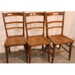 Set of three 19th century elm chairs, with turned supports and shaped seat bowls. Not available