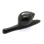 Ebony hatpin stand in the form of a snail. L: 23 cm. P&P Group 2 (£18+VAT for the first lot and £3+
