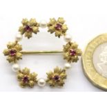 9ct gold ruby? and pearl set circular brooch, D: 28 mm, 3.8g. P&P Group 1 (£14+VAT for the first lot
