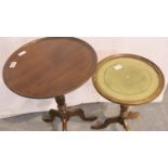Mahogany circular lamp table on tripod supports and a further leather top example. Not available for
